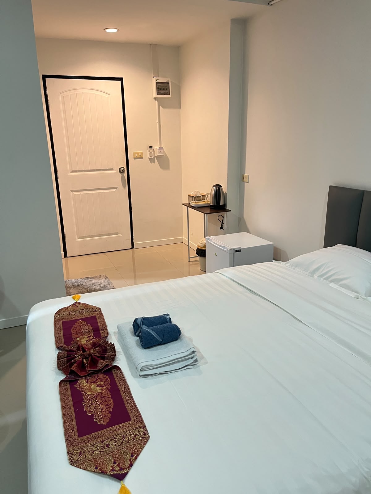 Room entrance with kettle and mini fridge